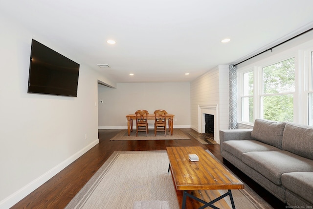 3743 Park Ave, Fairfield, CT 06825 - living room featuring dark wood-type flooring, recessed lighting, and a fireplace