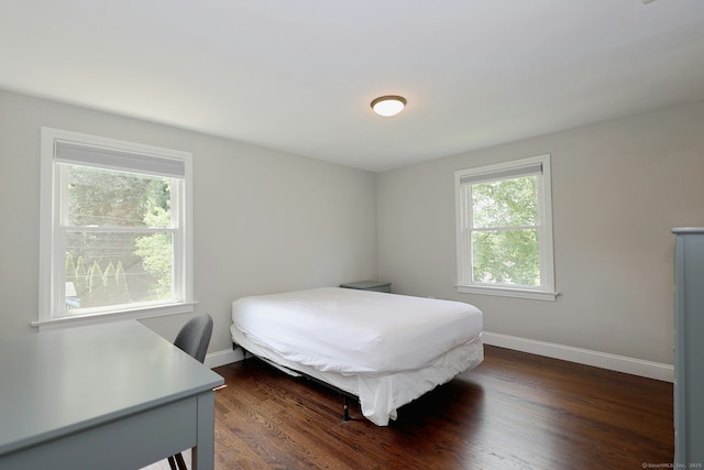 3743 Park Ave, Fairfield, CT 06825 - bedroom featuring multiple windows and dark wood finished floors