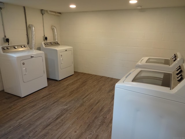 3743 Park Ave, Fairfield, CT 06825 - washroom featuring washing machine and dryer, concrete block wall, dark wood-style flooring, and recessed lighting