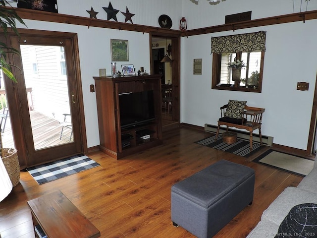 14 Cartier Rd, Enfield, CT 06082 - living area with baseboard heating and wood finished floors