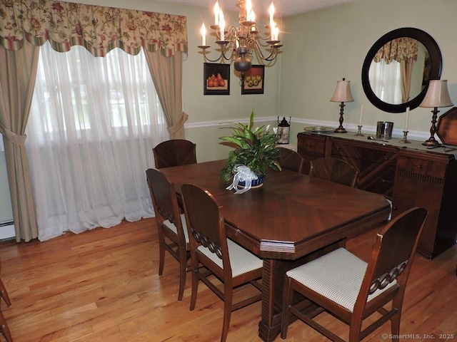 14 Cartier Rd, Enfield, CT 06082 - dining area featuring a chandelier and light wood finished floors