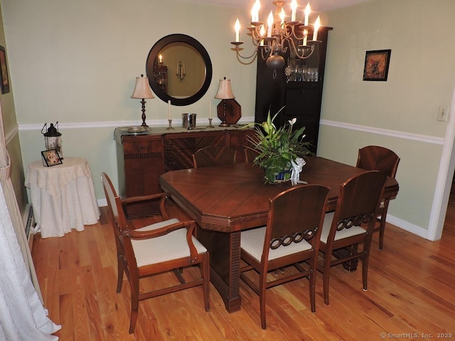 14 Cartier Rd, Enfield, CT 06082 - dining space with a chandelier and light wood-style flooring