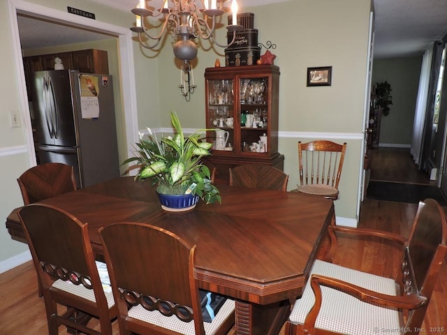 14 Cartier Rd, Enfield, CT 06082 - dining room featuring a chandelier and wood finished floors