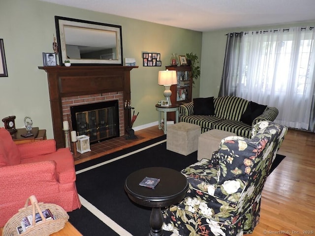 14 Cartier Rd, Enfield, CT 06082 - living area with wood finished floors and a fireplace