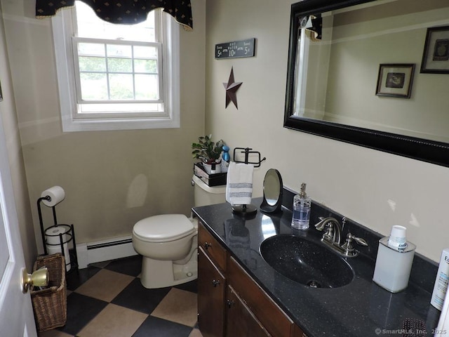 14 Cartier Rd, Enfield, CT 06082 - bathroom with a baseboard heating unit, vanity, and tile patterned floors