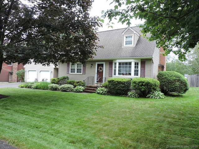 14 Cartier Rd, Enfield, CT 06082 - new england style home featuring a front yard, driveway, a shingled roof, and a chimney