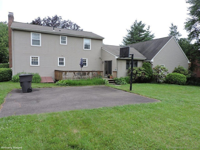 14 Cartier Rd, Enfield, CT 06082 - rear view of house with a wooden deck, a chimney, a patio area, and a yard