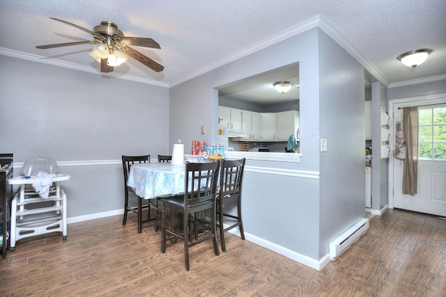 121 Lexington Ave Unit 21, New Haven, CT 06513 - dining area with a baseboard heating unit, wood finished floors, a ceiling fan, a textured ceiling, and ornamental molding