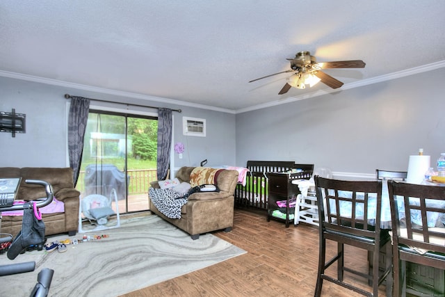 121 Lexington Ave Unit 21, New Haven, CT 06513 - bedroom with crown molding, access to exterior, wood finished floors, a wall mounted air conditioner, and a textured ceiling
