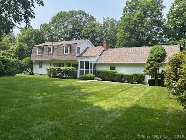 147 Beers Rd, Easton, CT 06612 - view of front facade featuring a front yard, a sunroom, and a chimney