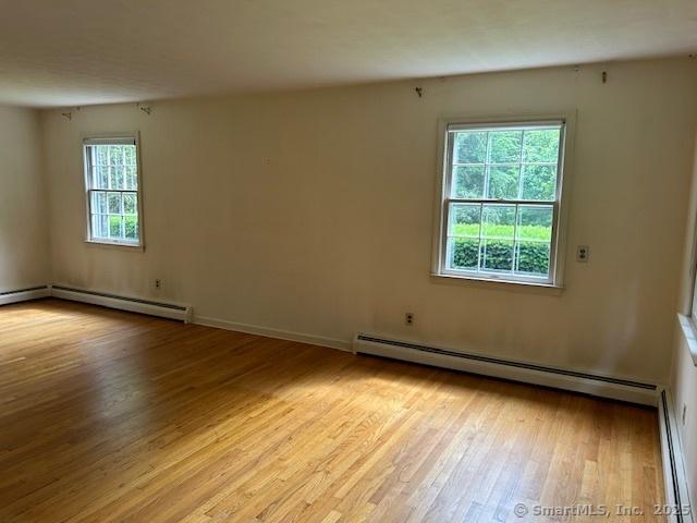 147 Beers Rd, Easton, CT 06612 - unfurnished room featuring baseboard heating and light wood finished floors