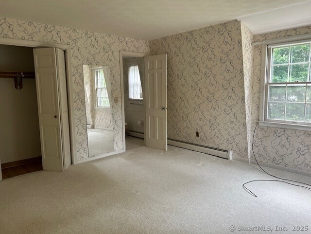 147 Beers Rd, Easton, CT 06612 - unfurnished bedroom with a baseboard heating unit, carpet floors, multiple windows, and wallpapered walls