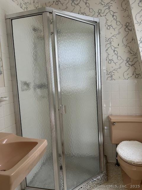 147 Beers Rd, Easton, CT 06612 - bathroom with tile walls, wallpapered walls, and a stall shower