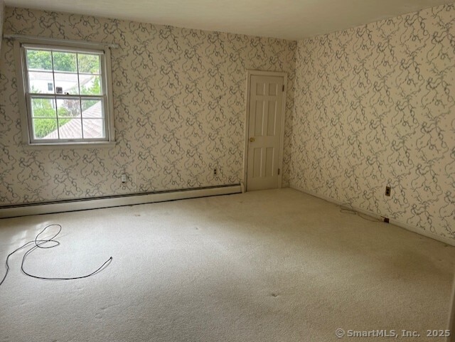 147 Beers Rd, Easton, CT 06612 - carpeted empty room featuring a baseboard heating unit
