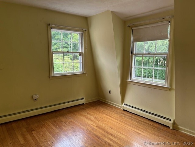 147 Beers Rd, Easton, CT 06612 - spare room featuring a baseboard radiator, plenty of natural light, and light wood-type flooring