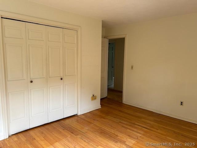 147 Beers Rd, Easton, CT 06612 - unfurnished bedroom with a closet and light wood-type flooring