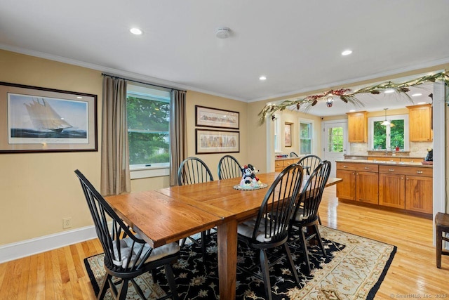 160 Disbrow St, Stratford, CT 06614 - dining area with crown molding, light wood-style floors, and recessed lighting