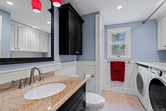 160 Disbrow St, Stratford, CT 06614 - bathroom with separate washer and dryer, a wainscoted wall, vanity, and recessed lighting