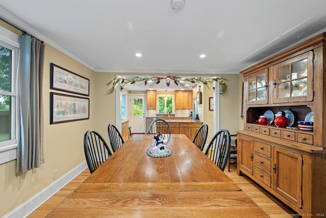 160 Disbrow St, Stratford, CT 06614 - dining room featuring light wood finished floors, ornamental molding, and recessed lighting