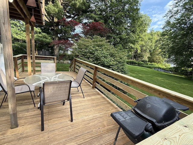 160 Disbrow St, Stratford, CT 06614 - wooden deck featuring outdoor dining space, a lawn, and a grill