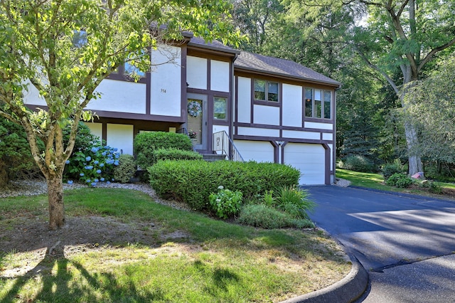 690 Forest Rd Unit 394, West Haven, CT 06516 - view of front facade with stucco siding, driveway, and an attached garage