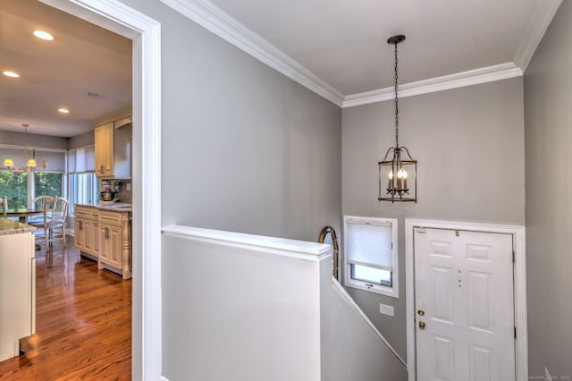 690 Forest Rd Unit 394, West Haven, CT 06516 - foyer featuring a chandelier, crown molding, dark wood-type flooring, and recessed lighting