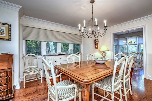 690 Forest Rd Unit 394, West Haven, CT 06516 - dining area featuring a chandelier, ornamental molding, and wood finished floors