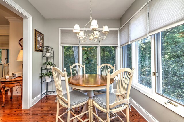 690 Forest Rd Unit 394, West Haven, CT 06516 - dining area with healthy amount of natural light, dark wood-type flooring, and a chandelier