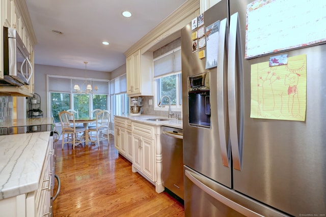 690 Forest Rd Unit 394, West Haven, CT 06516 - kitchen featuring appliances with stainless steel finishes, recessed lighting, light stone counters, light wood finished floors, and decorative backsplash