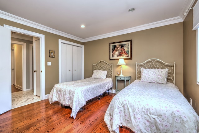 690 Forest Rd Unit 394, West Haven, CT 06516 - bedroom featuring wood finished floors, crown molding, a closet, and recessed lighting