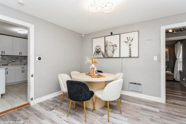 26 Trowbridge St, Waterbury, CT 06710 - dining area featuring light wood-style floors and baseboards
