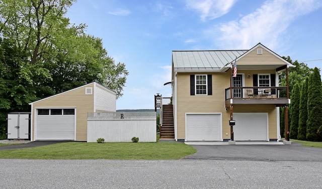 31 Bristol St, Thomaston, CT 06787 - view of front of house featuring a standing seam roof, a front lawn, stairs, and driveway