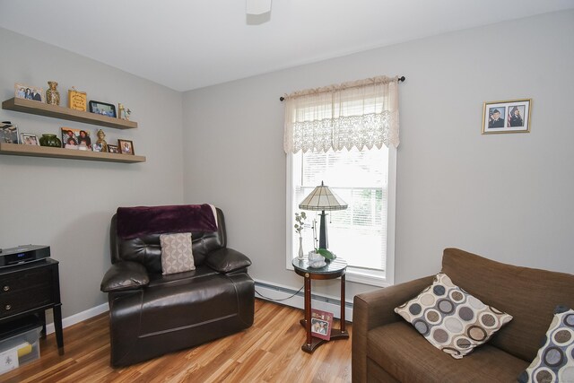 31 Bristol St, Thomaston, CT 06787 - sitting room featuring baseboard heating, wood finished floors, and a ceiling fan