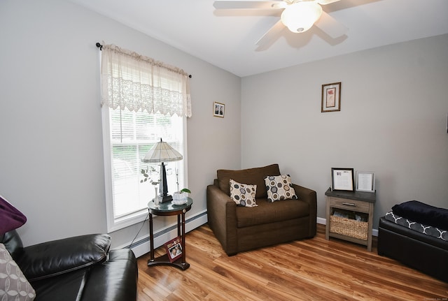 31 Bristol St, Thomaston, CT 06787 - living area featuring a baseboard radiator, plenty of natural light, light wood finished floors, and a ceiling fan