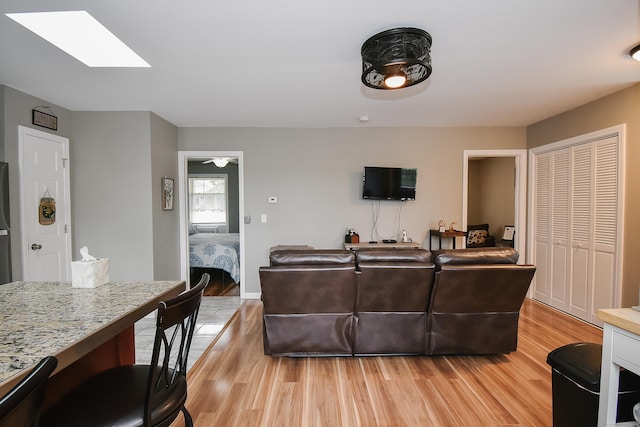31 Bristol St, Thomaston, CT 06787 - living room with a skylight and light wood-style flooring