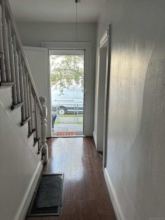 595 William St, Bridgeport, CT 06608 - doorway featuring dark wood-type flooring and baseboards
