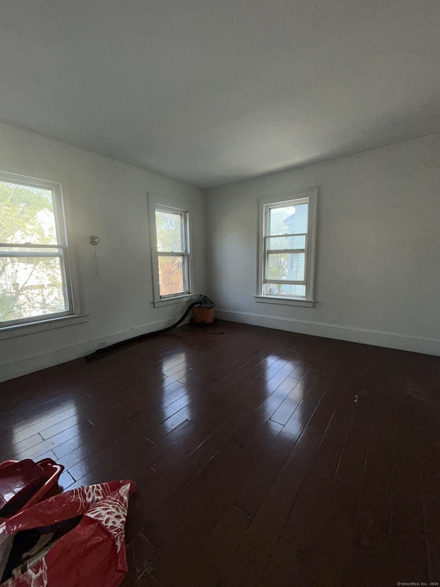 595 William St, Bridgeport, CT 06608 - unfurnished room featuring dark wood finished floors and baseboards
