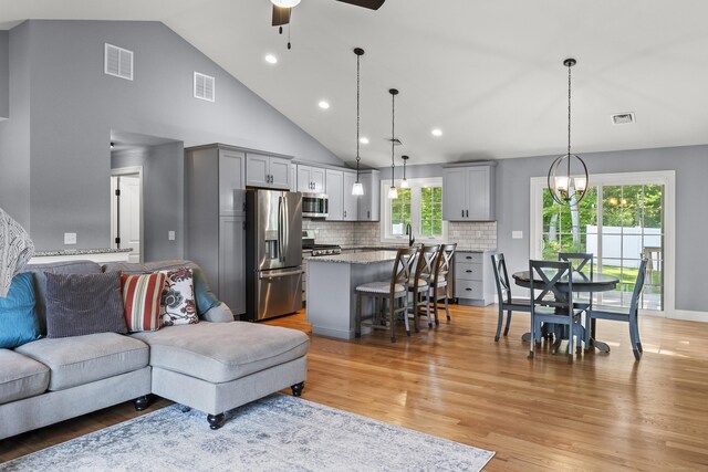 46 Airport Rd, Killingly, CT 06239 - living area with a ceiling fan, a chandelier, light wood-type flooring, recessed lighting, and high vaulted ceiling