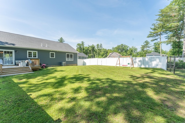 46 Airport Rd, Killingly, CT 06239 - fenced backyard featuring a deck and a playground