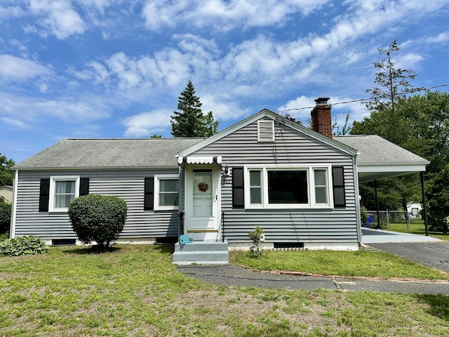 462 Halfway House Rd, Windsor Locks, CT 06096 - view of front of house with a chimney, asphalt driveway, an attached carport, a shingled roof, and a front lawn