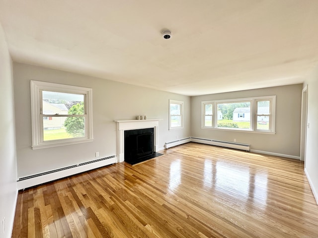 462 Halfway House Rd, Windsor Locks, CT 06096 - unfurnished living room featuring a baseboard heating unit, wood finished floors, and a fireplace with flush hearth