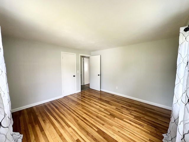 462 Halfway House Rd, Windsor Locks, CT 06096 - unfurnished bedroom with wood finished floors and baseboards