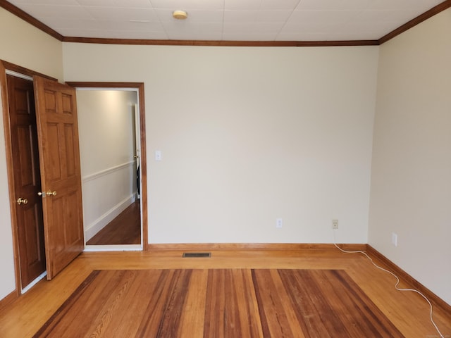18 Hunters Ave, Norwich, CT 06380 - empty room with ornamental molding, wood finished floors, and a smoke detector