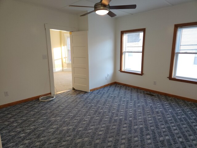 18 Hunters Ave, Norwich, CT 06380 - empty room with ceiling fan, dark colored carpet, and ornamental molding