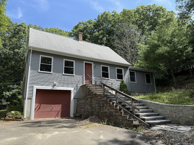 394 Merrow Rd, Coventry, CT 06238 - view of front of property with a chimney and asphalt driveway