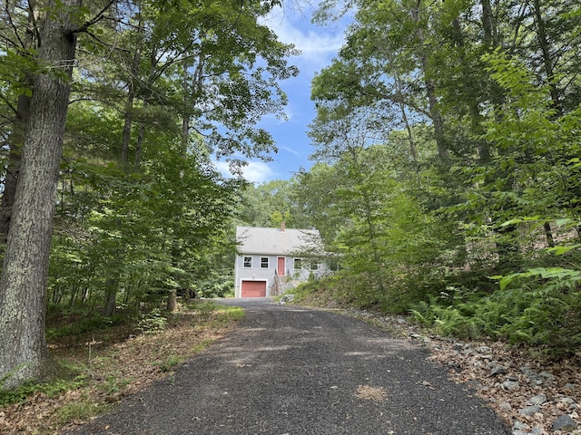 394 Merrow Rd, Coventry, CT 06238 - view of property hidden behind natural elements featuring driveway and a garage