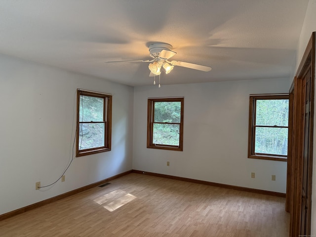 394 Merrow Rd, Coventry, CT 06238 - empty room featuring light wood-style floors and a ceiling fan