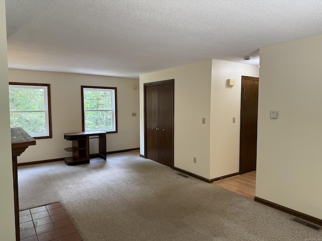 394 Merrow Rd, Coventry, CT 06238 - spare room featuring light colored carpet and a textured ceiling