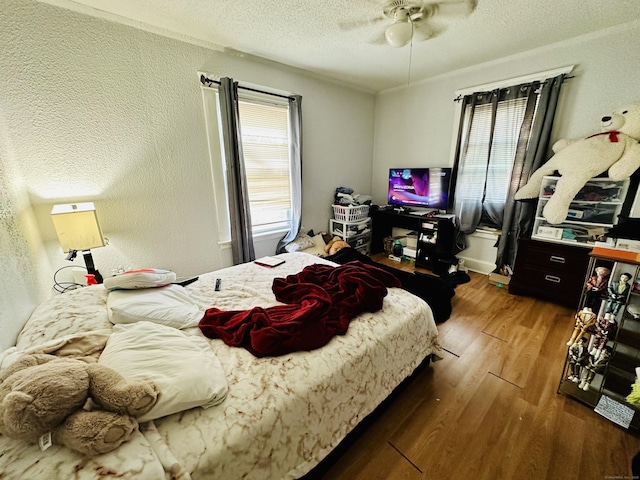 182 Oak St, Waterbury, CT 06704 - bedroom featuring wood finished floors, a textured ceiling, ceiling fan, and a textured wall