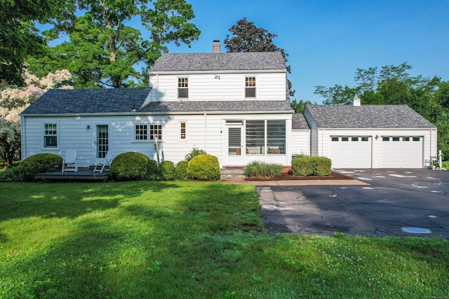 22 Spring Rd, North Haven, CT 06473 - view of front facade featuring asphalt driveway, a chimney, a front yard, an attached garage, and a wooden deck